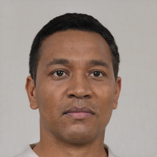 Neutral black young-adult male with short  black hair and brown eyes