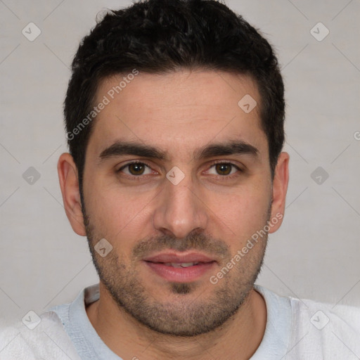 Joyful white young-adult male with short  black hair and brown eyes