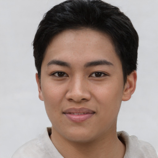 Joyful asian young-adult female with short  black hair and brown eyes