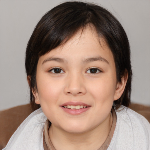 Joyful white child female with medium  brown hair and brown eyes