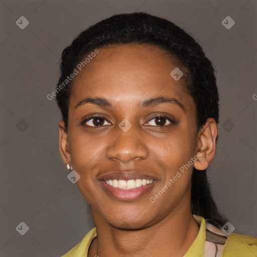 Joyful black young-adult female with short  black hair and brown eyes