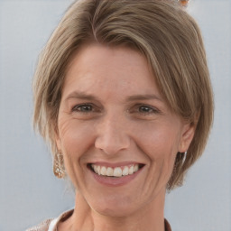 Joyful white adult female with medium  brown hair and grey eyes