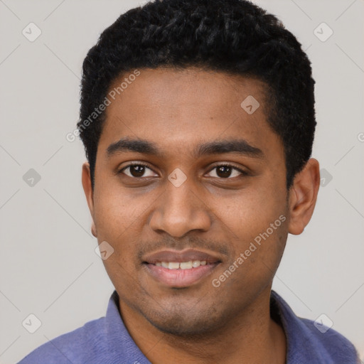 Joyful black young-adult male with short  black hair and brown eyes