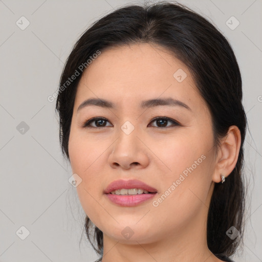 Joyful asian young-adult female with medium  brown hair and brown eyes