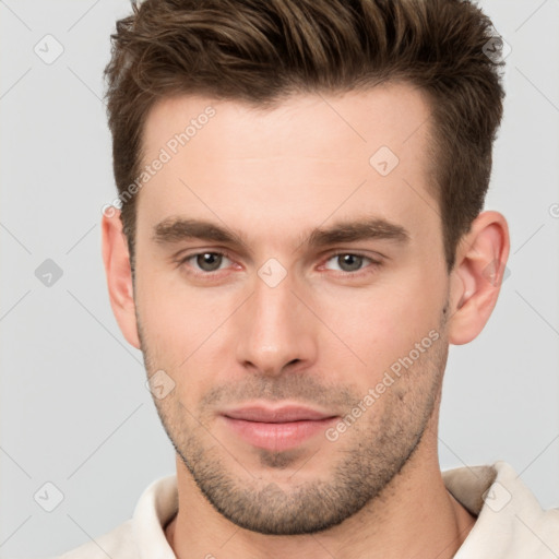 Neutral white young-adult male with short  brown hair and brown eyes