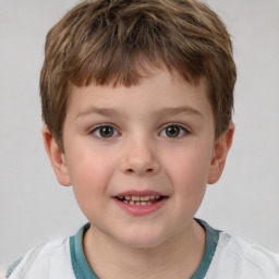 Joyful white child male with short  brown hair and brown eyes