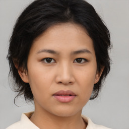 Neutral asian young-adult female with medium  brown hair and brown eyes