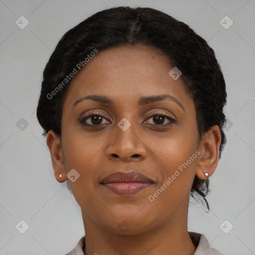 Joyful black young-adult female with short  brown hair and brown eyes