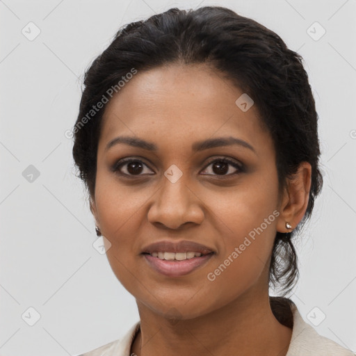 Joyful black young-adult female with medium  black hair and brown eyes