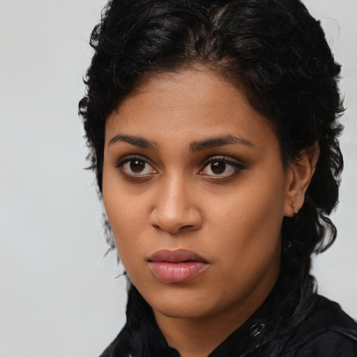 Neutral latino young-adult female with long  black hair and brown eyes