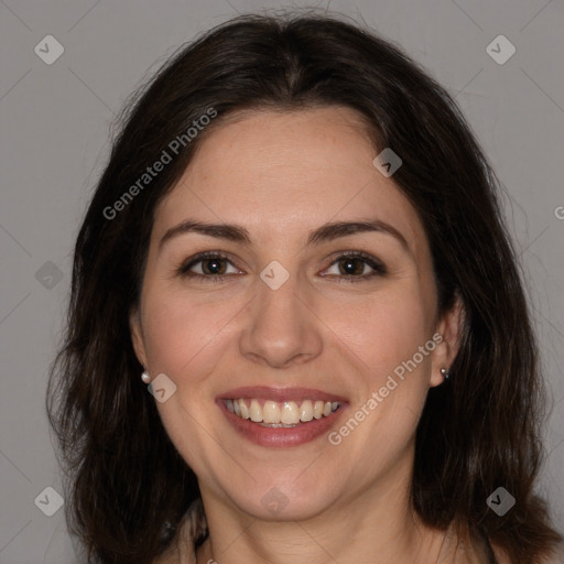 Joyful white adult female with medium  brown hair and brown eyes