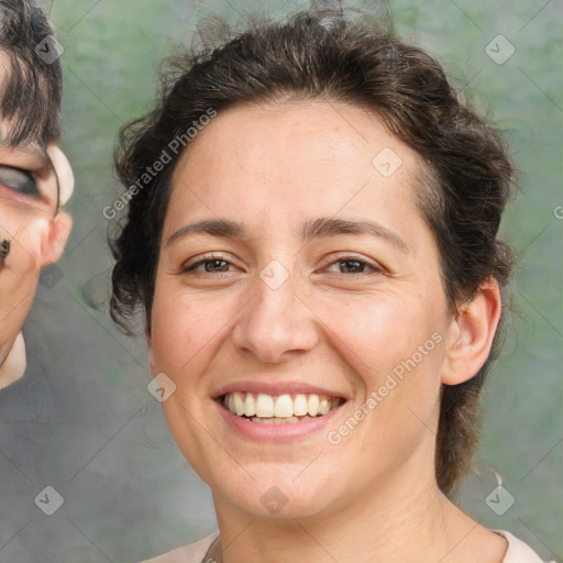 Joyful white adult female with short  brown hair and brown eyes