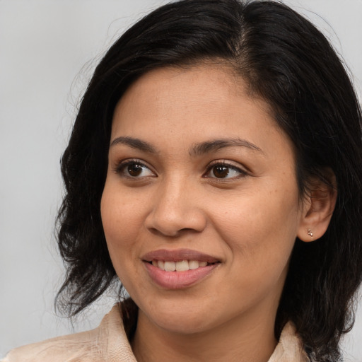 Joyful white young-adult female with medium  brown hair and brown eyes