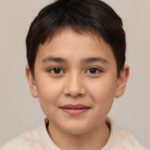 Joyful white child female with short  brown hair and brown eyes