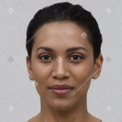 Joyful latino young-adult female with short  black hair and brown eyes