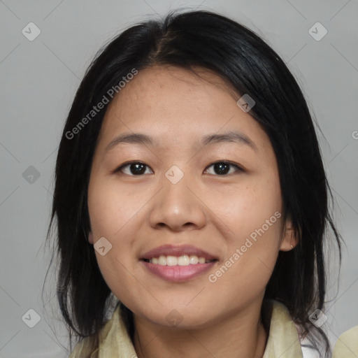 Joyful asian young-adult female with medium  black hair and brown eyes