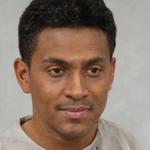 Neutral black young-adult male with short  brown hair and brown eyes