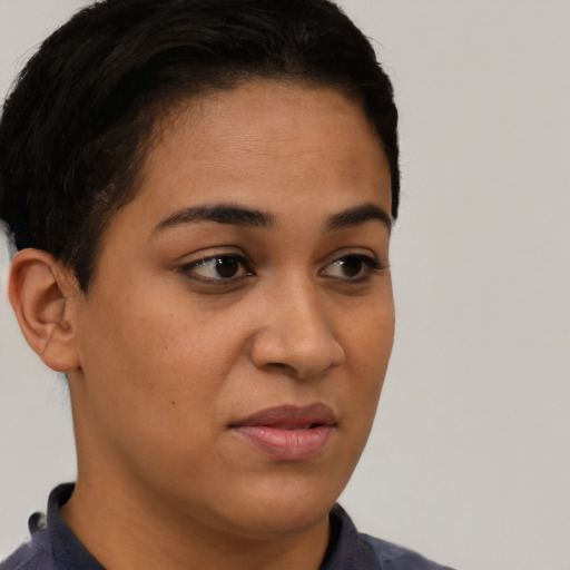 Joyful latino young-adult female with short  brown hair and brown eyes