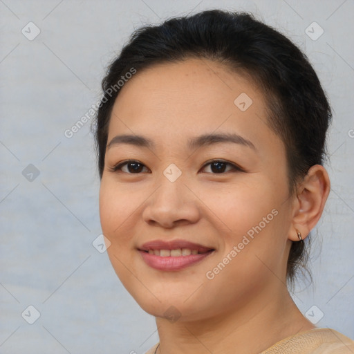 Joyful latino young-adult female with medium  brown hair and brown eyes