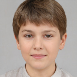 Joyful white child male with short  brown hair and brown eyes