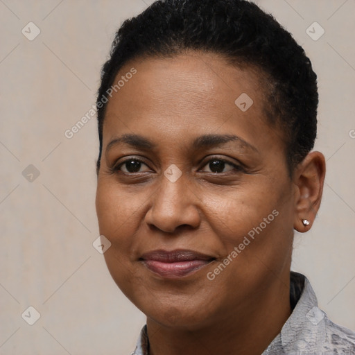 Joyful black young-adult female with short  brown hair and brown eyes