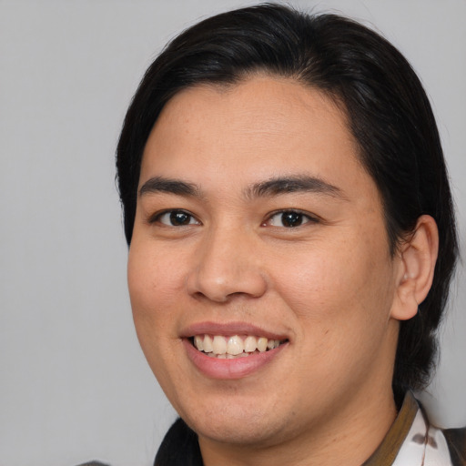 Joyful asian young-adult male with medium  brown hair and brown eyes