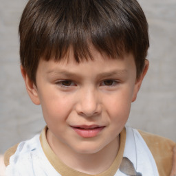 Joyful white child male with short  brown hair and brown eyes