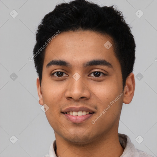 Joyful latino young-adult male with short  black hair and brown eyes