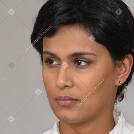 Neutral white young-adult female with medium  brown hair and brown eyes