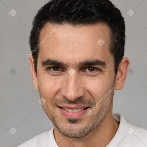 Joyful white adult male with short  brown hair and brown eyes