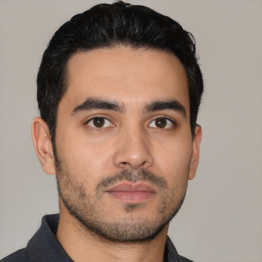 Neutral latino young-adult male with short  black hair and brown eyes