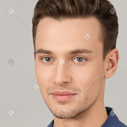 Joyful white young-adult male with short  brown hair and brown eyes