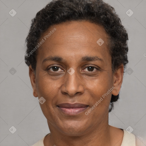 Joyful black adult female with short  brown hair and brown eyes