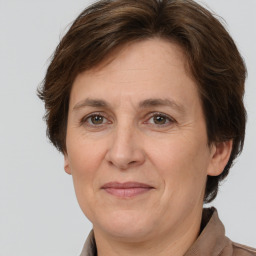 Joyful white adult female with short  brown hair and brown eyes