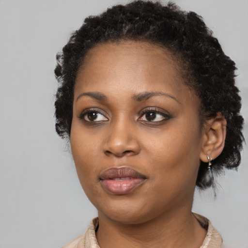 Neutral black young-adult female with short  black hair and brown eyes