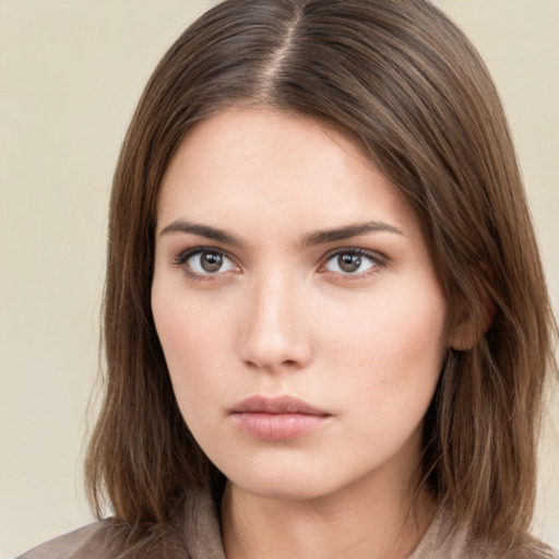 Neutral white young-adult female with long  brown hair and brown eyes