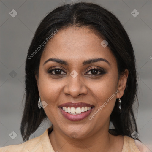 Joyful black young-adult female with medium  brown hair and brown eyes