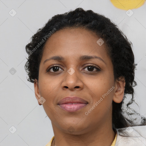 Joyful black young-adult female with medium  brown hair and brown eyes