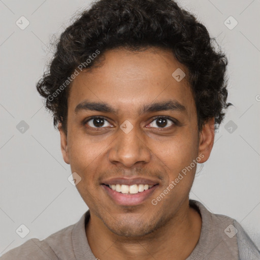 Joyful black young-adult male with short  brown hair and brown eyes