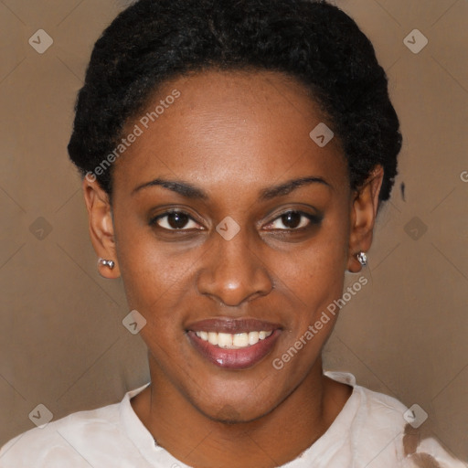 Joyful black young-adult female with short  black hair and brown eyes