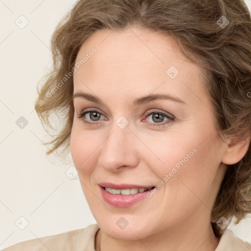 Joyful white young-adult female with medium  brown hair and green eyes