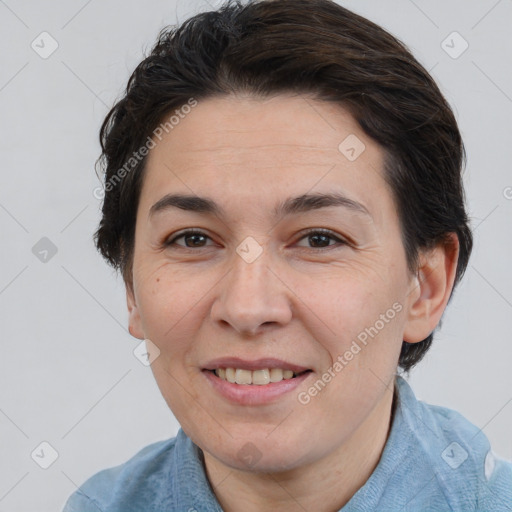 Joyful white adult female with short  brown hair and brown eyes