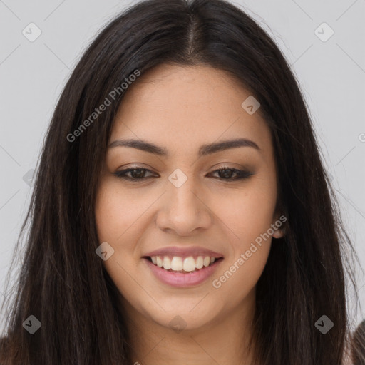 Joyful latino young-adult female with long  brown hair and brown eyes