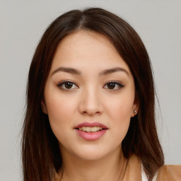 Joyful asian young-adult female with long  brown hair and brown eyes