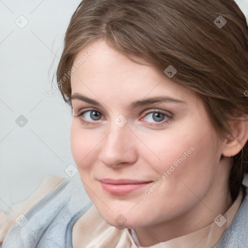 Joyful white young-adult female with medium  brown hair and blue eyes