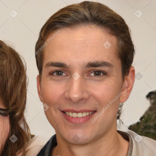 Joyful white young-adult male with medium  brown hair and brown eyes