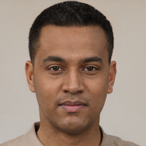 Neutral latino young-adult male with short  black hair and brown eyes