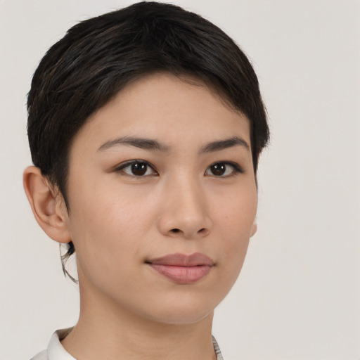 Joyful asian young-adult female with short  brown hair and brown eyes