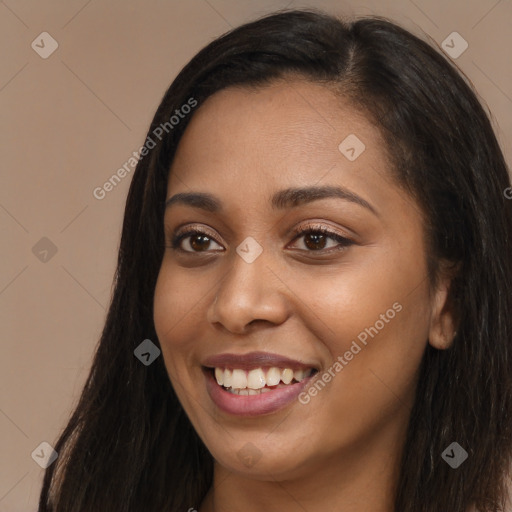 Joyful latino young-adult female with long  brown hair and brown eyes