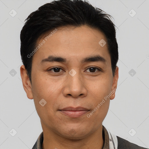 Joyful asian young-adult male with short  black hair and brown eyes